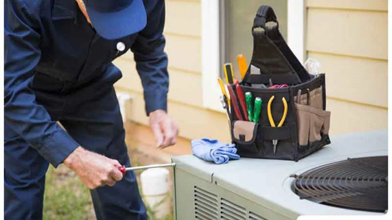 Homeowner checking AC vent with no cool air in Dallas home
