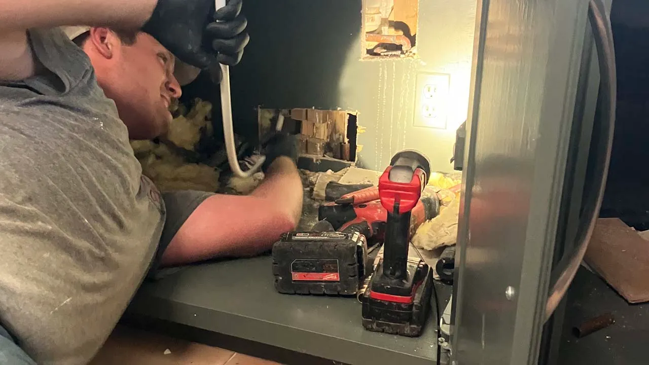 AC repair cost breakdown and technician writing estimate