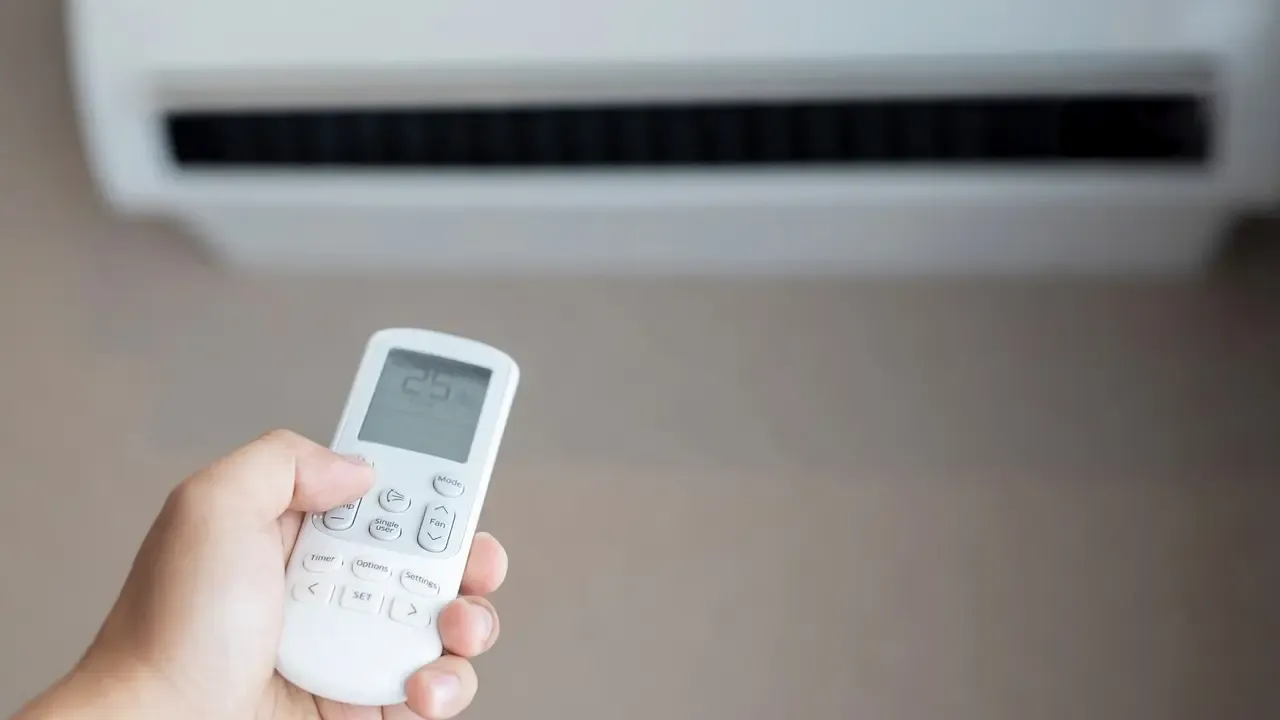 HVAC technician performing AC maintenance tune-up in Dallas